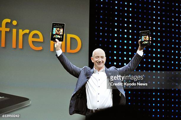 United States - Amazon.com Inc. CEO Jeff Bezos releases the Kindle Fire HD tablet during an event in Santa Monica, California, on Sept. 6, 2012.