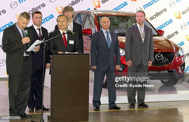 Russia - Russian President Vladimir Putin and Mazda Motor Corp. President Takashi Yamanouchi attend an opening ceremony for a Mazda car assembly line...