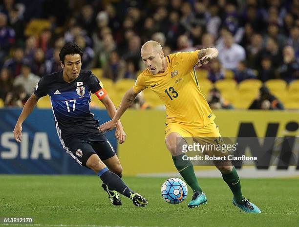 Aaron Mooy of Australia is chased by Makoto Hasebe of Japan during the 2018 FIFA World Cup Qualifier match between the Australian Socceroos and Japan...