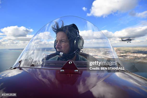 Pilot Pedro Langton flies his Travel Air 4000 biplane during a photocall for the launch of the Vintage Air Rally in Shoreham, Sussex on October 10,...