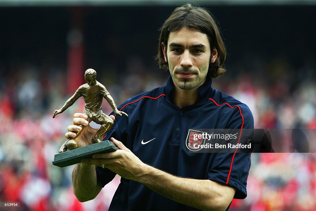 Robert Pires of Arsenal with the Football Writers Player of the Year Award