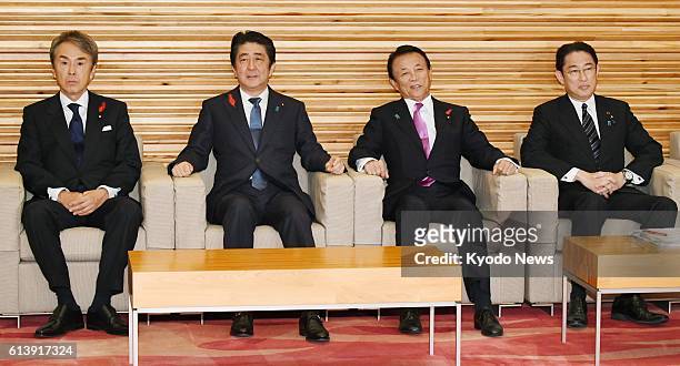 Nobuteru Ishihara , Japan's minister in charge of economic revitalization, Prime Minister Shinzo Abe, Finance Minister Taro Aso and Foreign Minister...