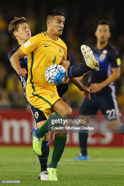 Gotoku Sakai of Japan and Tim Cahill of the Socceroos compete for the ball during the 2018 FIFA World Cup Qualifier match between the Australian...