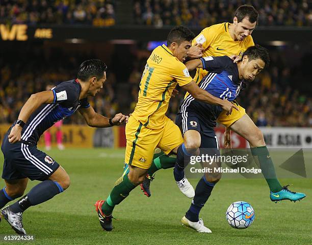 Takuma Asano of Japan compete for the ball against Massimo Luongo of the Socceroos during the 2018 FIFA World Cup Qualifier match between the...