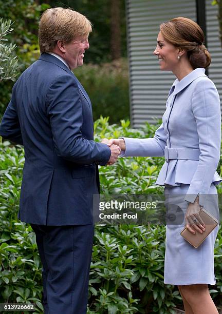 Catherine, Duchess of Cambridge meets King Willem Alexander of the Netherlands at Villa Eikenhorst on October 11, 2016 in The Hague, Netherlands.