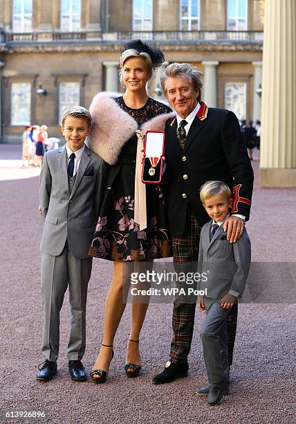 Sir Rod Stewart with his wife, Penny Lancaster and children Alastair and Aiden after he received his knighthood in recognition of his services to...