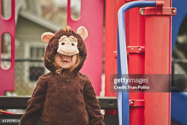 toddler girl in a halloween costume. - baby monkey stock pictures, royalty-free photos & images
