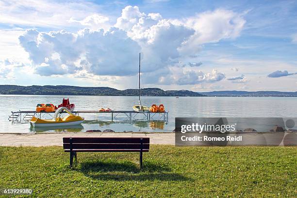 lake balaton - bench on the beach - lake balaton beach stock pictures, royalty-free photos & images