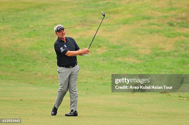 Darren Clarke of Northern Ireland plays a shot during practice for the 2016 Venetian Macao Open at Macau Golf and Country Club on October 11, 2016 in...