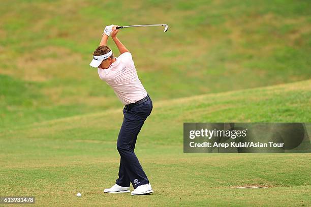 Ian Poulter of England plays a shot during practice for the 2016 Venetian Macao Open at Macau Golf and Country Club on October 11, 2016 in Macau,...