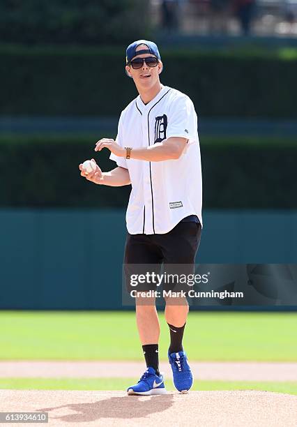 Olympic silver medalist swimmer Connor Jaeger throws out the ceremonial first pitch prior to the game between the Detroit Tigers and the Minnesota...