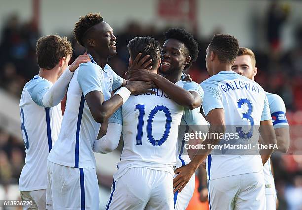 Josh Onomah of England U21 celebrates with Jack Grealish and team mates as he scores their third goal during the UEFA European U21 Championship Group...