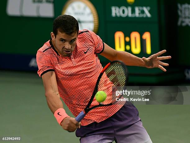 Grigor Dimitrov of Bulgaria returns a shot to Richard Gasquet of France during second round of ATP Shanghai Rolex Masters 2016 on Day 3 at Qi Zhong...