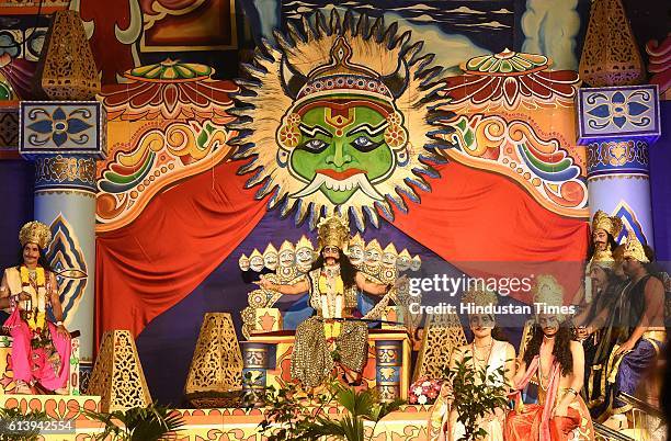 An artist perform as Ravana during Ramleela, organized by the Nav Shri Dharmik Leela committee, at Red Fort, on October 9, 2016 in New Delhi, India....