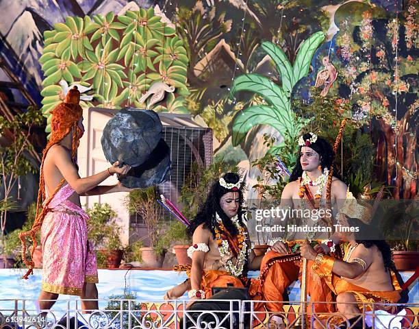 Artists perform as Rama, Laxman, Ravana and Hanuman during a Ramleela, organized by the Nav Shri Dharmik Leela committee, at Red Fort, on October 9,...