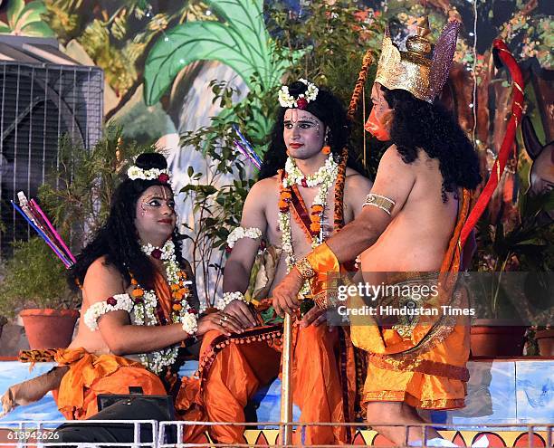 Artists perform as Rama, Laxman, Ravana and Hanuman during a Ramleela, organized by the Nav Shri Dharmik Leela committee, at Red Fort, on October 9,...