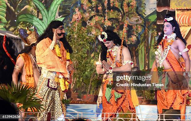 Artists perform as Rama, Laxman, Ravana and Hanuman during a Ramleela, organized by the Nav Shri Dharmik Leela committee, at Red Fort, on October 9,...