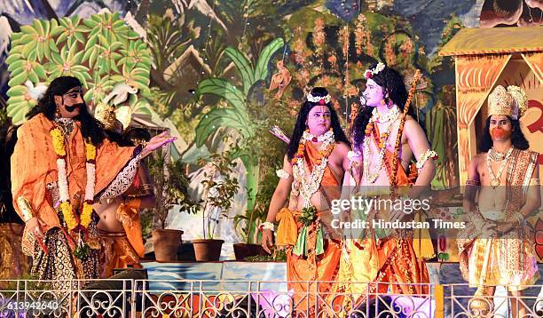 Artists perform as Rama, Laxman, Ravana and Hanuman during a Ramleela, organized by the Nav Shri Dharmik Leela committee, at Red Fort, on October 9,...