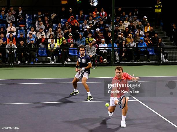 Marcin Matkowski of Poland and Jean-Julien Rojer of Netherlands in action against Martin Klizan of Slovakia and Joao Sousa of Portugal in a match in...