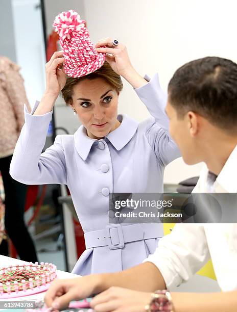 Catherine, Duchess of Cambridge meets pupils in a woollen class at Bouwkeet workshop project for teenagers on October 11, 2016 in Rotterdam,...