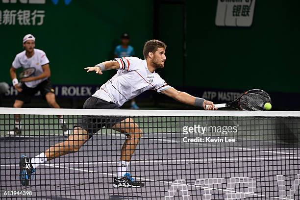 Martin Klizan of Slovakia and Joao Sousa of Portugal in action against Marcin Matkowski of Poland and Jean-Julien Rojer of Netherlands during a match...