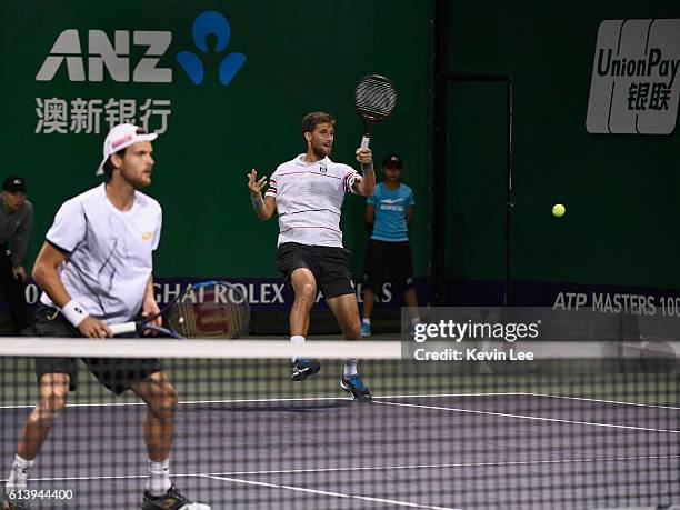 Martin Klizan of Slovakia and Joao Sousa of Portugal in action against Marcin Matkowski of Poland and Jean-Julien Rojer of Netherlands during a match...