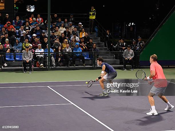 Marcin Matkowski of Poland and Jean-Julien Rojer of Netherland in action against Martin Klizan of Slovakia and Joao Sousa of Portugal in a match in...