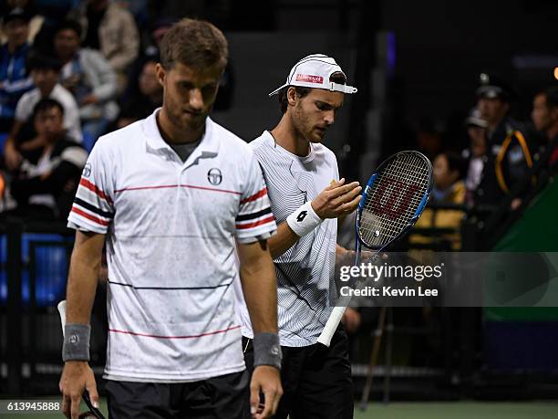 Martin Klizan of Slovakia and Joao Sousa of Portugal in action against Marcin Matkowski of Poland and Jean-Julien Rojer of Netherland during a match...