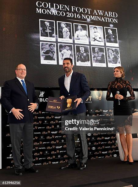 Prince Albert II of Monaco, winner of the Golden Foot 2016 Award trophy Gianluigi Buffon and Martina Colombari attend the Golden Foot Ceremony Award...