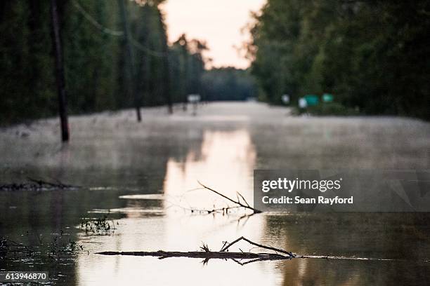 Roadway is flooded by remnants of Hurricane Matthew on October 11, 2016 near Dillon, South Carolina. The region is still assessing the full magnitude...