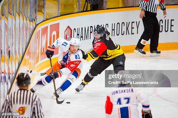 Simon Backman of Lappeenranta challenges Jukka Peltola of Tampere during the Champions Hockey League Round of 32 match between SaiPa Lappeenranta and...