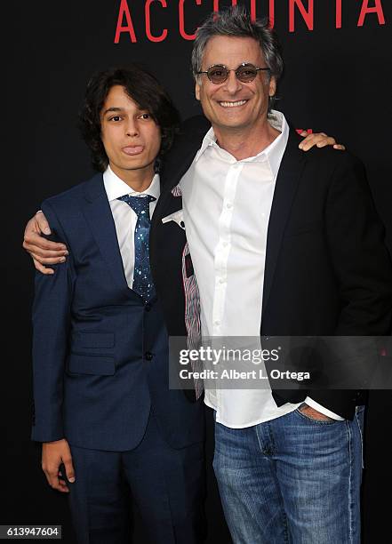 Actor Rio Mangini and father Mark Mangini arrive for the Premiere Of Warner Bros Pictures' "The Accountant" held at TCL Chinese Theatre on October...