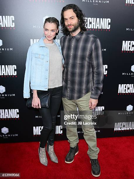 Cassi Colvin and Chris D'Elia attend the premiere of Summit Entertainment's 'Mechanic: Resurrection' on August 22, 2016 in Hollywood, California.