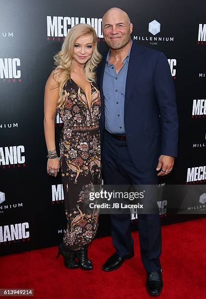 Mindy Robinson and Randy Couture attend the premiere of Summit Entertainment's 'Mechanic: Resurrection' on August 22, 2016 in Hollywood, California.