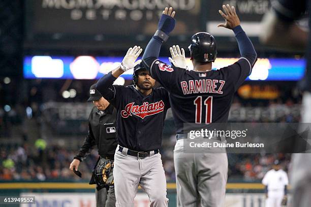 Coco Crisp of the Cleveland Indians celebrates with Jose Ramirez of the Cleveland Indians after hitting a two-run home run against the Detroit Tigers...