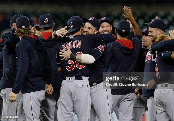 Tyler Naquin of the Cleveland Indians receives a hug from Jason Kipnis of the Cleveland Indians as they celebrate the Indians Central Division...