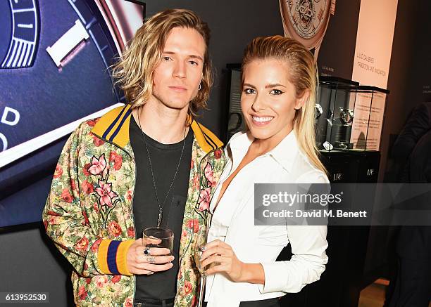 Dougie Poynter and Mollie King attend the cocktail opening of the Chopard exhibition 'L.U.C - L'art d'une Manufacture' at Phillips Gallery on October...