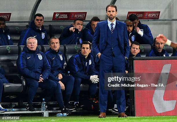 Wayne Rooney of England points as Interim England Manager Gareth Southgate watches the action from the touchline during the FIFA 2018 World Cup...