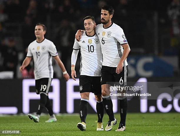 Sami Khedira of Germany celebrates scoring his sides second goal with Mesut Oezil of Germany during the FIFA 2018 World Cup Qualifier between Germany...