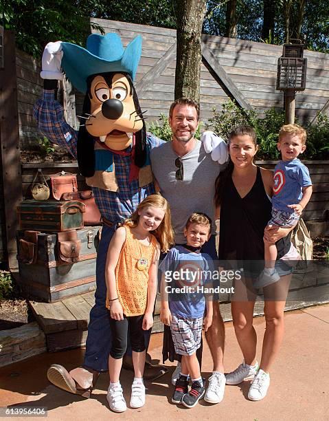 In this handout photo provided by Disney Parks, : Actor Scott Foley from ABC's 'Scandal', wife Marika Dominczyk and children, Konrad, 22 months,...