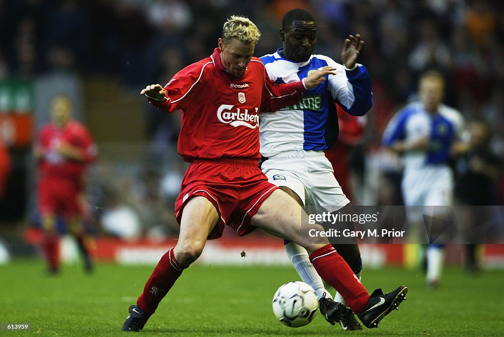 Stephane Henchoz of Liverpool and Andy Cole of Blackburn Rovers