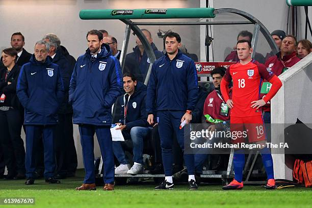 Interim England Manager Gareth Southgate watches the action nas Wayne Rooney of England prepares to come on as a substitute during the FIFA 2018...