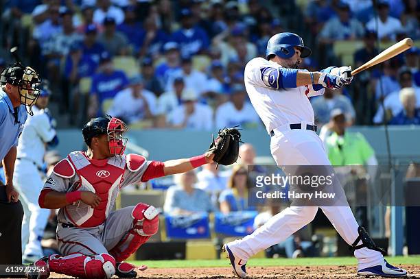 Adrian Gonzalez of the Los Angeles Dodgers hits a two-run homerun in the first inning against the Washington Nationals during game four of the...
