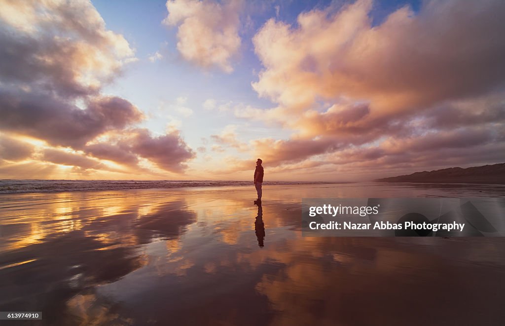 Man standing on beach.