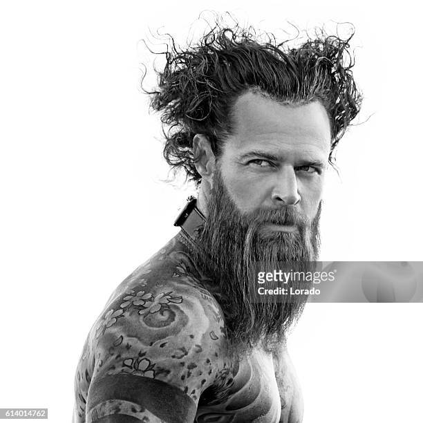 heavily tattooed bare chested handsome male standing in warrior stance - hairy men bildbanksfoton och bilder