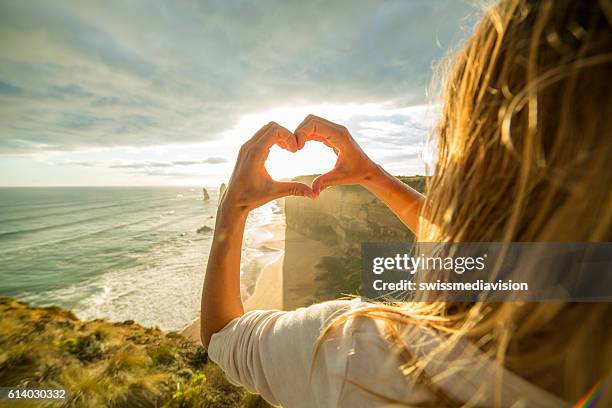 female traveling loves the twelve apostles, australia - apostles australia stock pictures, royalty-free photos & images