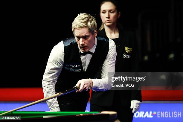 Neil Robertson of Australia reacts against Hamza Akbar of Pakistan during the first round match on day two of the Coral English Open 2016 at Event...