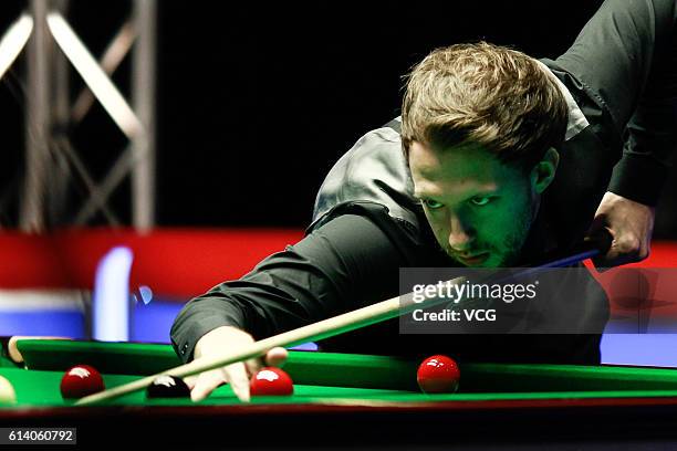 Judd Trump of England plays a shot against Ken Doherty of Ireland during the first round match on day two of the Coral English Open 2016 at Event...