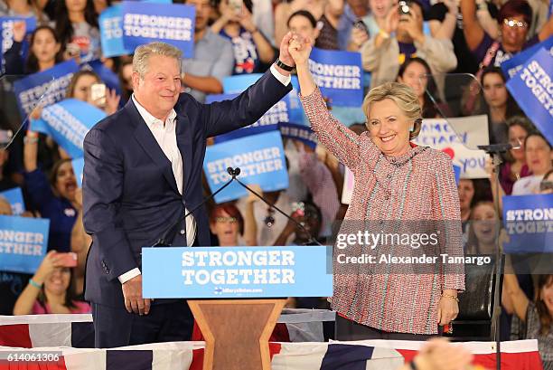 Democratic presidential nominee former Secretary of State Hillary Clinton and Vice President Al Gore are seen as they campaign together at the Miami...