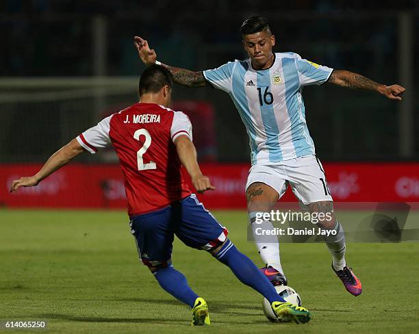 Marcos Rojo, of Argentina, and Jorge Moreira, of Paraguay, fight for the ball during a match between Argentina and Paraguay as part of FIFA 2018...